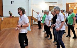 parishioners participating in line dancing