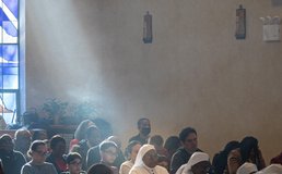 ray of light shining on churchgoers
