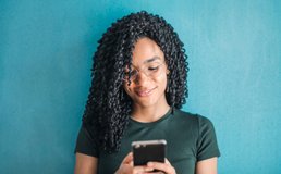woman using app on a cell phone