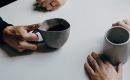 two people having coffee together