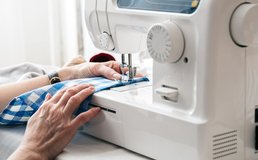 Hands Working With Sewing Machine