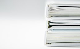 three binders full of paper
