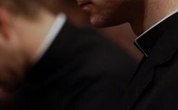 closeup of priests in Roman collars