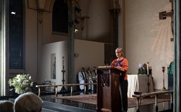 parishioner reading during Mass