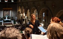 director of music leading choir