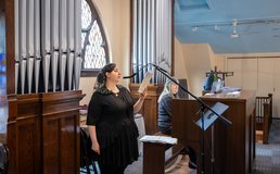 woman singing during Mass