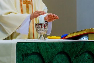 Priest At Altar Blessing Wine 1