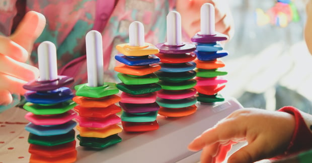 close up of a brightly colored children's stacking toy