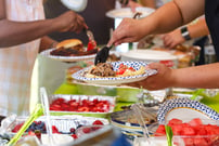 people get food at a potluck