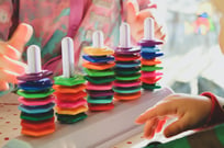 close up of a brightly colored children's stacking toy