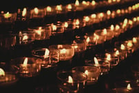 close up for rows of votive candles