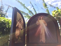 An image of the Divine Mercy shines in the sun