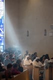 ray of light shining on churchgoers