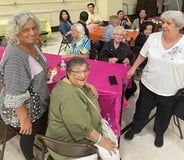 senior citizen women at prayer meeting