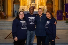 four catechists gathered for group photo in church
