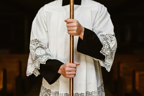 Altar Server holding processional Cross